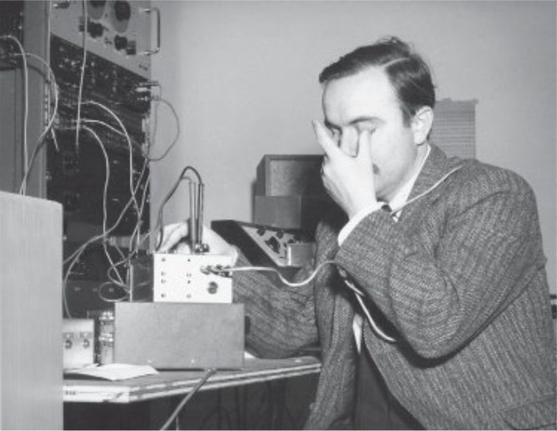 Alvin Lucier at electronic equipment