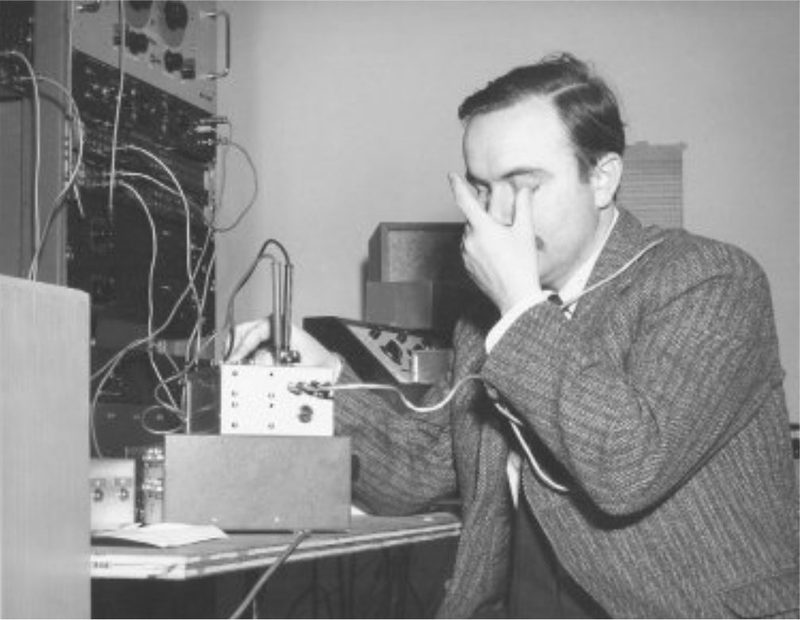 Alvin Lucier at electronic equipment