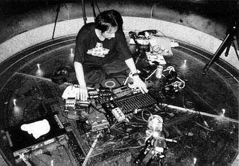 Akifumi Nakajima (Aube) surrounded by electronic equipment