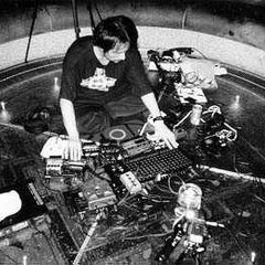 Akifumi Nakajima (Aube) surrounded by electronic equipment