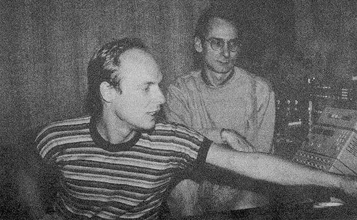 Jon Hassell and Brian Eno in the studio at a mixing console