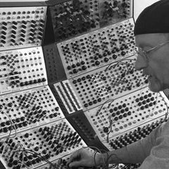 Black-and-white photograph of Kevin Fortune working at a Serge modular system