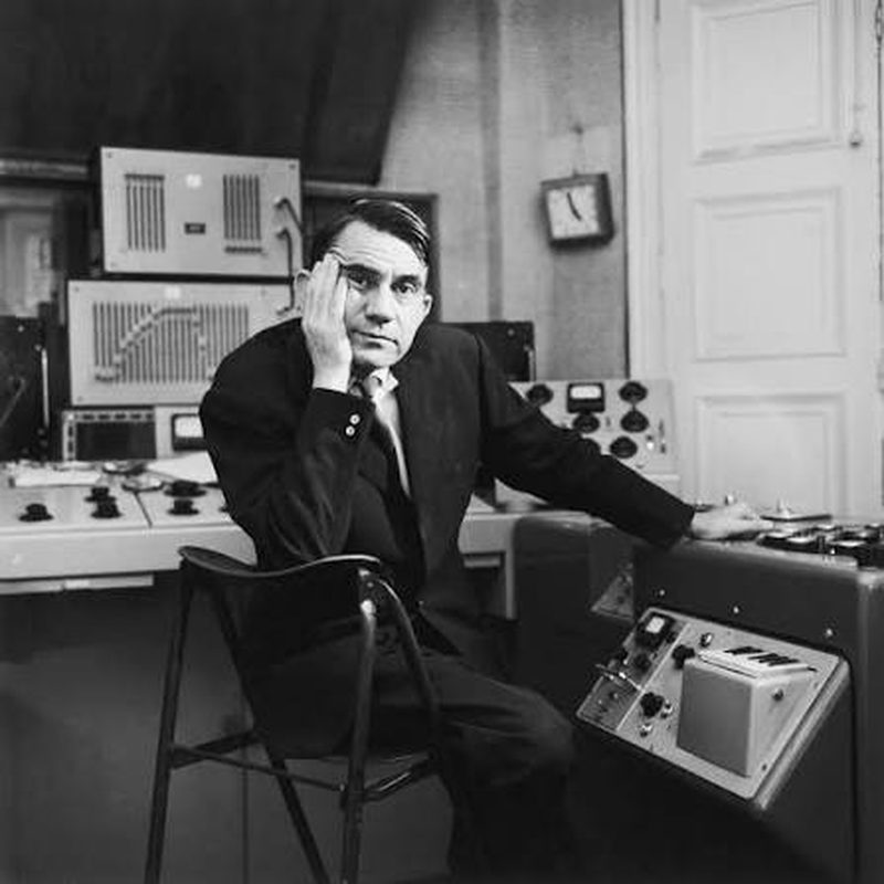 Pierre Schaeffer seated at a studio console