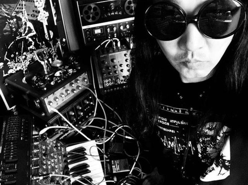 Maso Yamazaki (Space Machine) surrounded by vintage synthesizers
