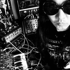 Maso Yamazaki (Space Machine) surrounded by vintage synthesizers
