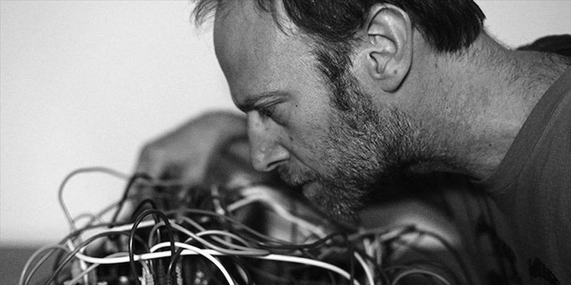 Steve Roden closely mic'd over a tangle of patch cables
