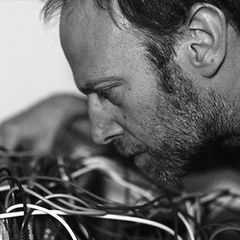 Steve Roden closely mic'd over a tangle of patch cables