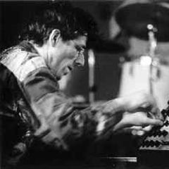 Thomas Lehn performing on his analog synthesizer, hands on the patch panel