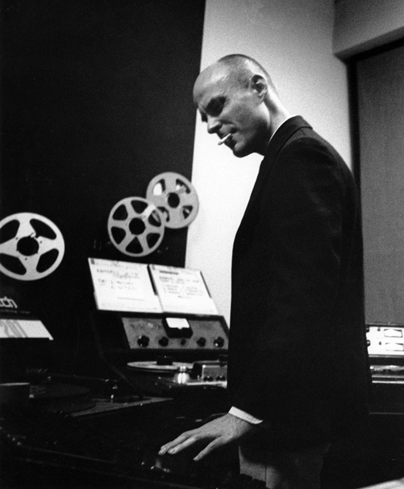 Tod Dockstader beside reel-to-reel tape machines in a studio