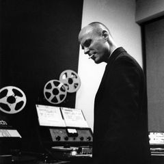 Tod Dockstader beside reel-to-reel tape machines in a studio
