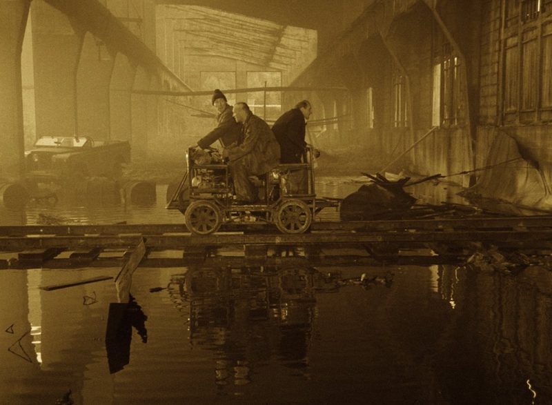 The three men riding the handcar into the Zone in Tarkovsky's Stalker