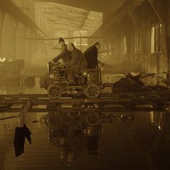 The three men riding the handcar into the Zone in Tarkovsky's Stalker