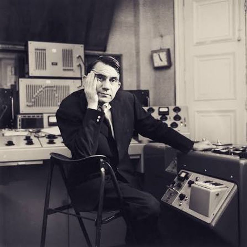 Pierre Schaeffer seated at a studio console